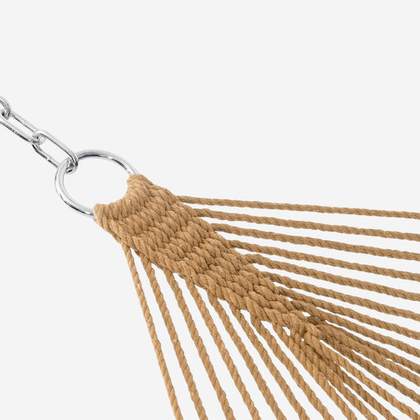 Close-up of a beige hammock with metal ring on a white background