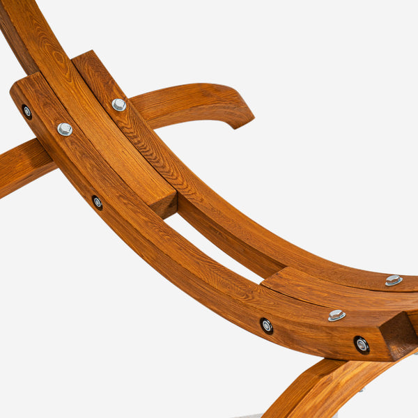 Close-up of a wooden chair with metal bolts on a white background