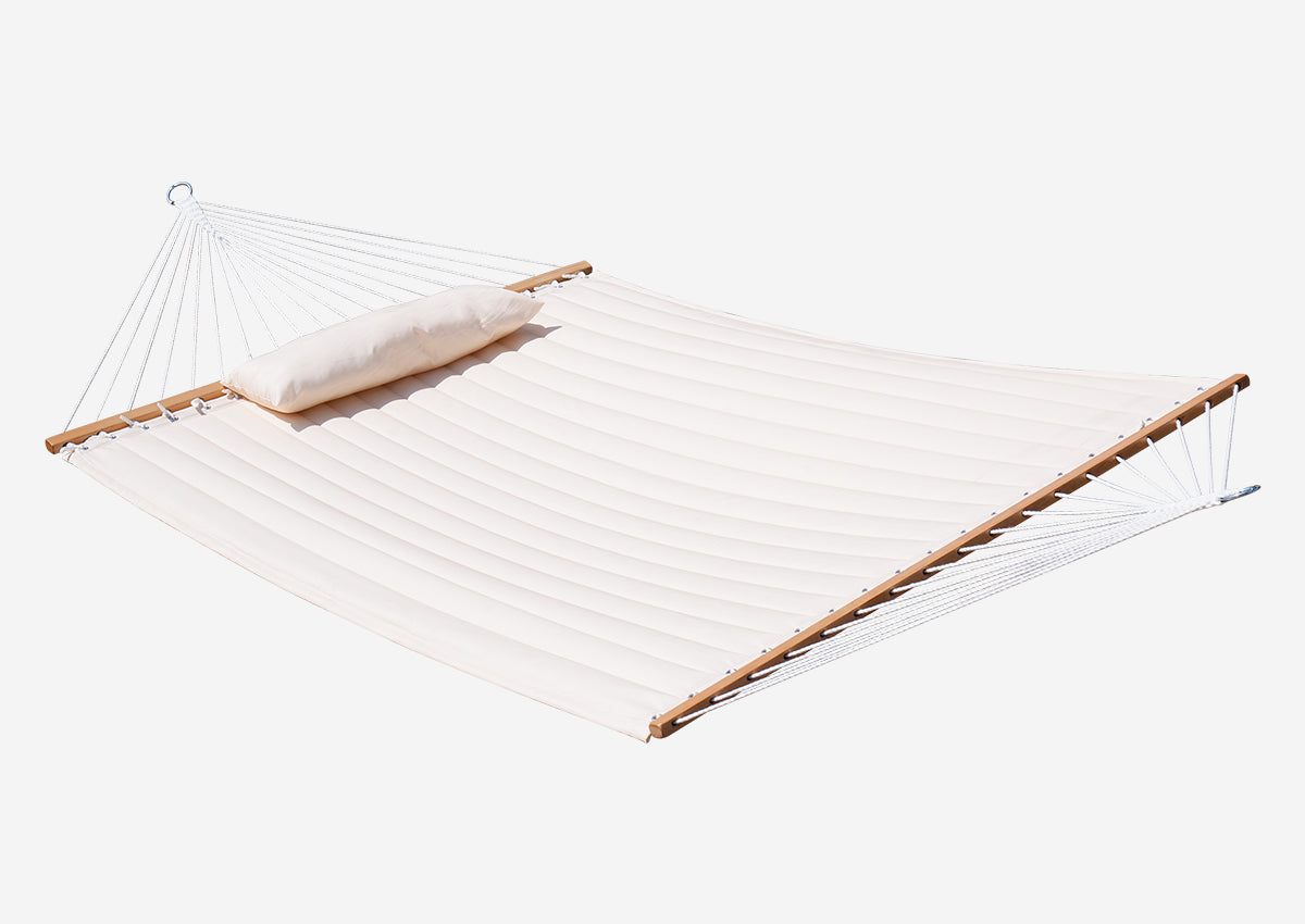 White hammock with wooden bars on a white background