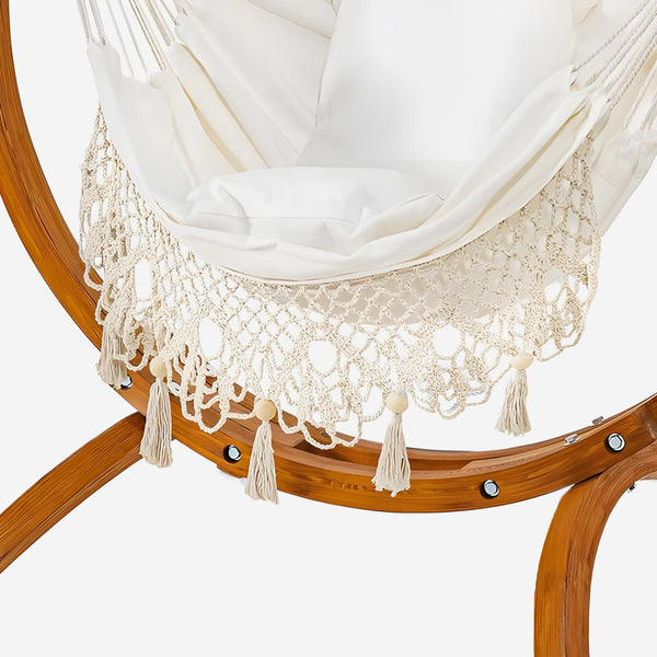 Wooden chair with a white hammock and lace trim on a white background