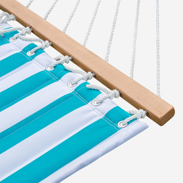 Close-up of a turquoise and white striped hammock with wooden frame on a white background