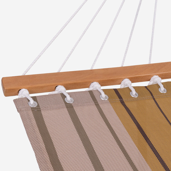 Close-up of a striped hammock with wooden rod and plastic clips on a white background