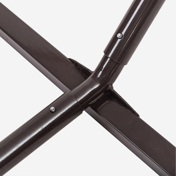 Close-up of a black metal frame with screws on a white background