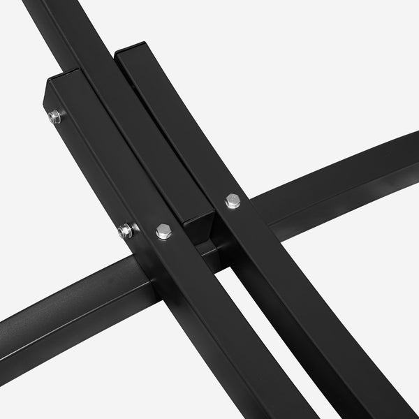 Close-up of a black metal stand on a white background
