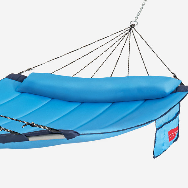 Blue hammock with a pillow on a white background
