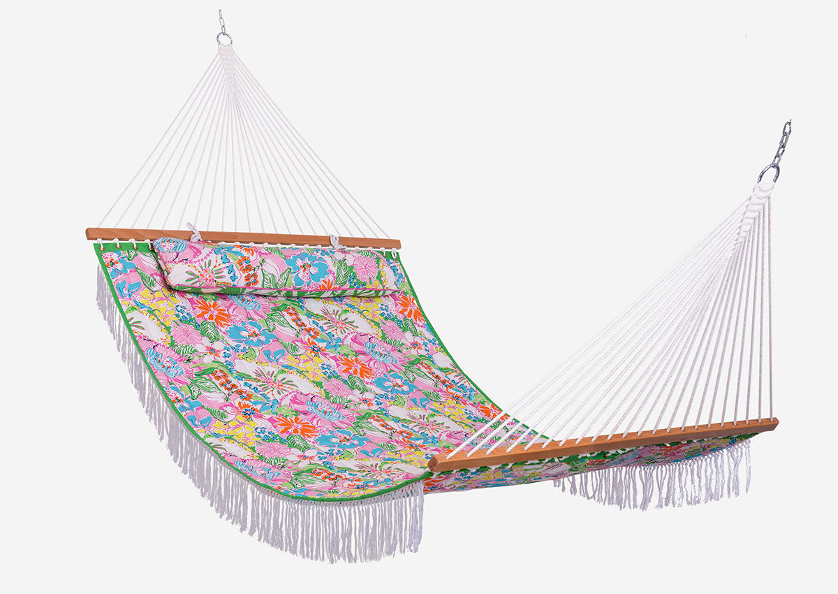 White hammock with wooden bars on a white background