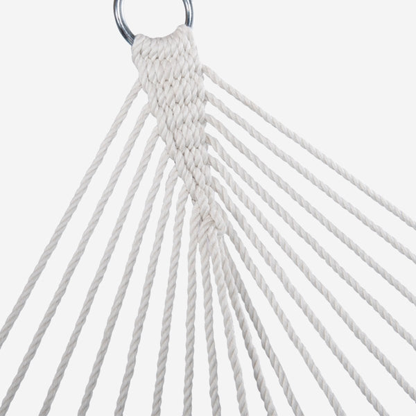 Close-up of a white rope hammock with a metal ring on a light gray background