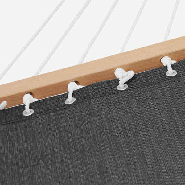 Close-up of a hammock with wooden frame and gray fabric, showing white plastic clips securing the fabric.