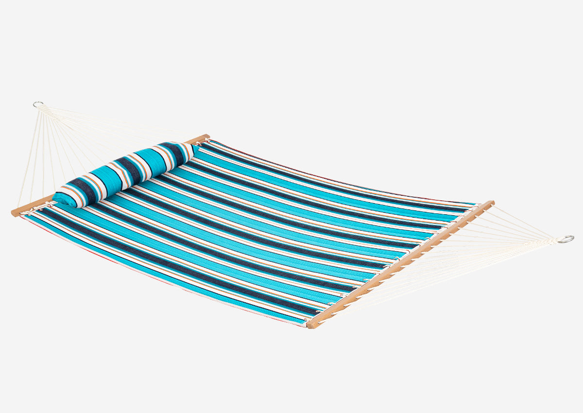 Striped hammock with blue and green pattern on a white background
