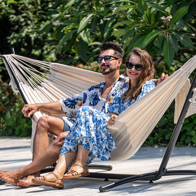 Lazy Daze Brazilian Premium Polycotton Hammock Combo set up in a backyard with a couple relaxing.#color_natural