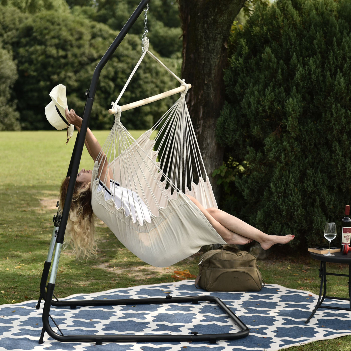 Lazy Daze hammock chair with pillows, relaxing outdoor scene.#color_natural