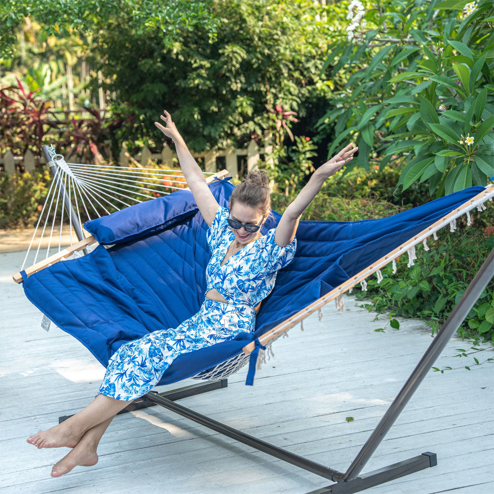 Lazy Daze Cotton Rope Hammock Combo in backyard with woman enjoying the outdoors.#color_blue