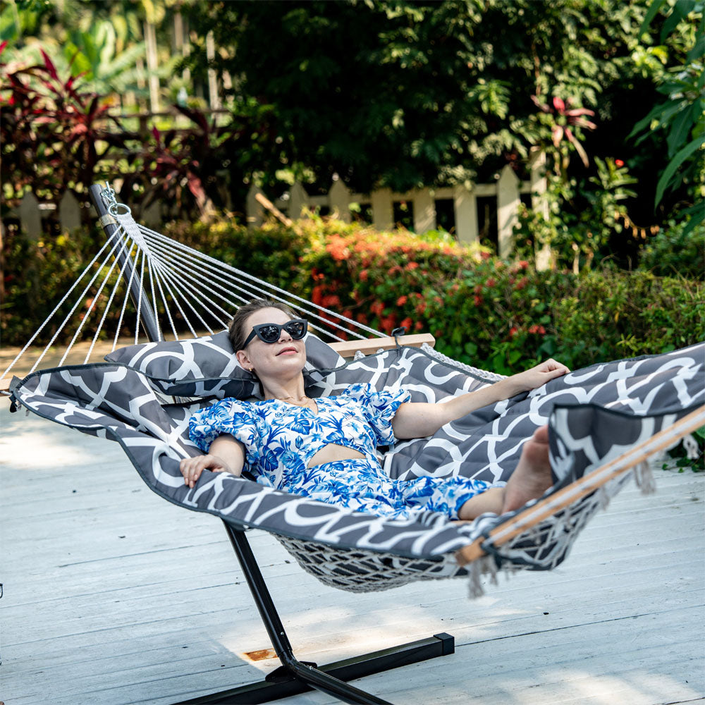 Lazy Daze Cotton Rope Hammock Combo, woman lounging in the backyard.#color_gray-white