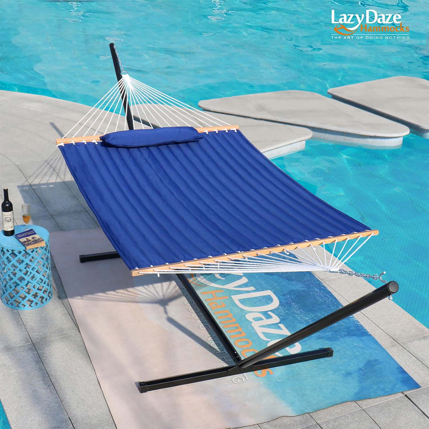 Lazy Daze Deluxe Quilted Fabric Hammock Combo by the poolside.#color_blue