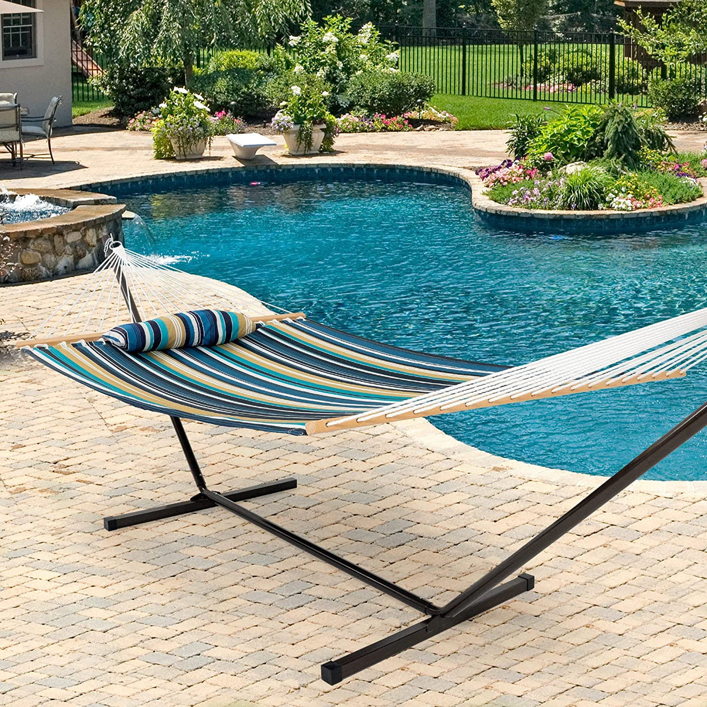 Lazy Daze Deluxe Quilted Fabric Hammock Combo on a steel stand in the backyard.#color_blue-strips