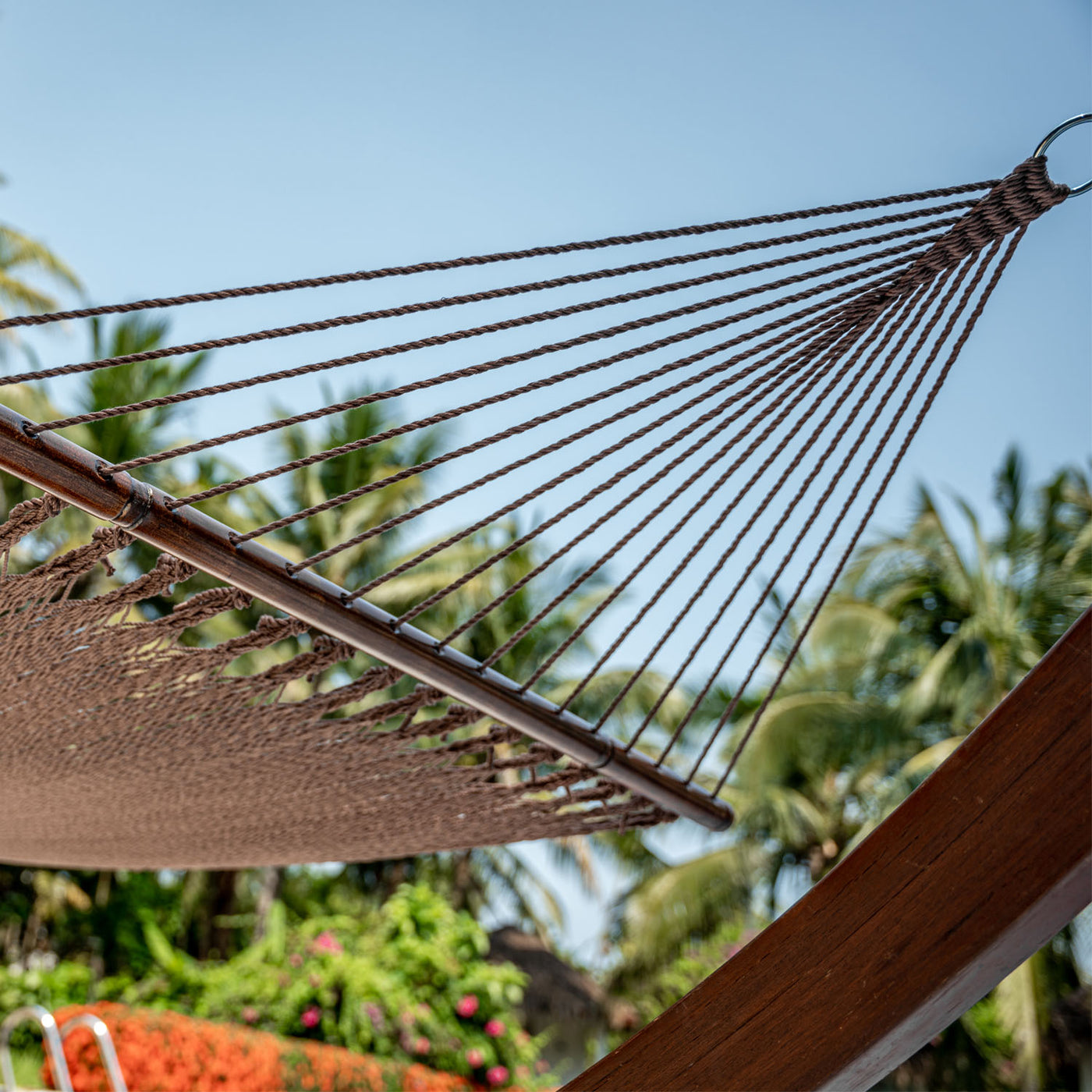 Detailed view of the hardwood spreader bar on Lazy Daze Double Caribbean Rope Hammock in Brown.#color_brown