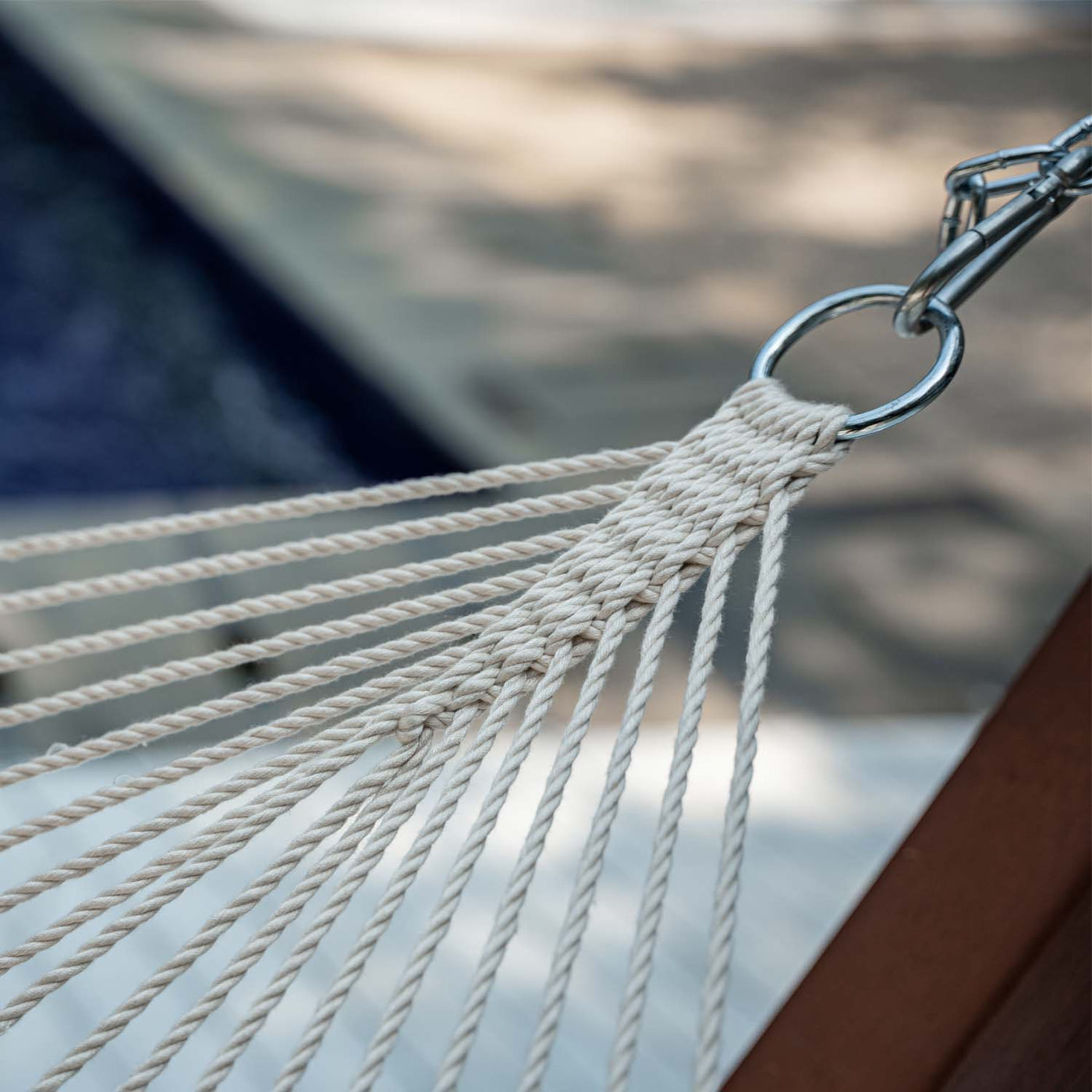 Close-up of the crafted rope knot on Lazy Daze Double Caribbean Rope Hammock in Gream.#color_gream