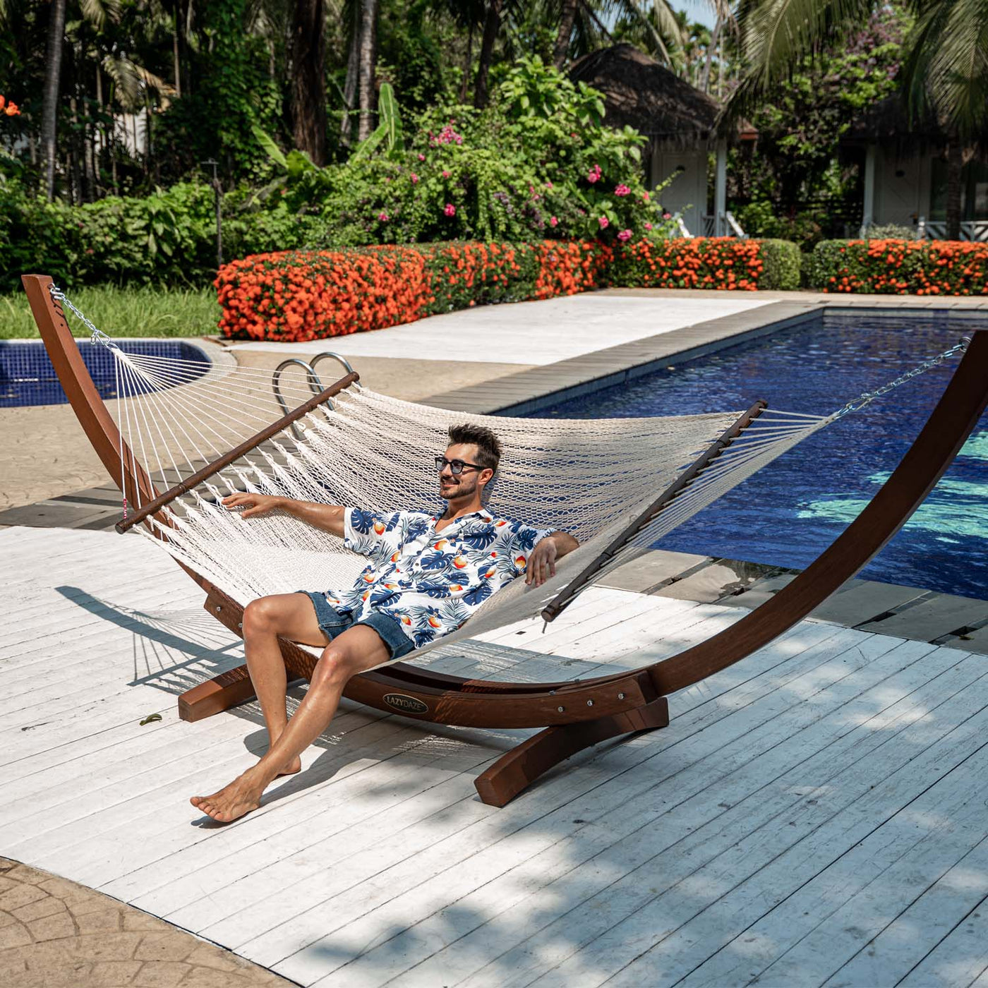 Enjoying the sun on Lazy Daze Double Caribbean Rope Hammock in Cream by the pool.#color_gream