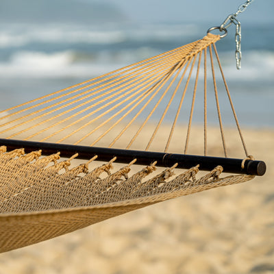 Close-up of the spreader bar on the Lazy Daze Double Caribbean Rope Hammock in Tan, showcasing its smooth finish.#color_tan