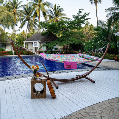 Lazy Daze Double Hammock with Curved Spreader Bar in Illy placed by the poolside for relaxation.#color_illy