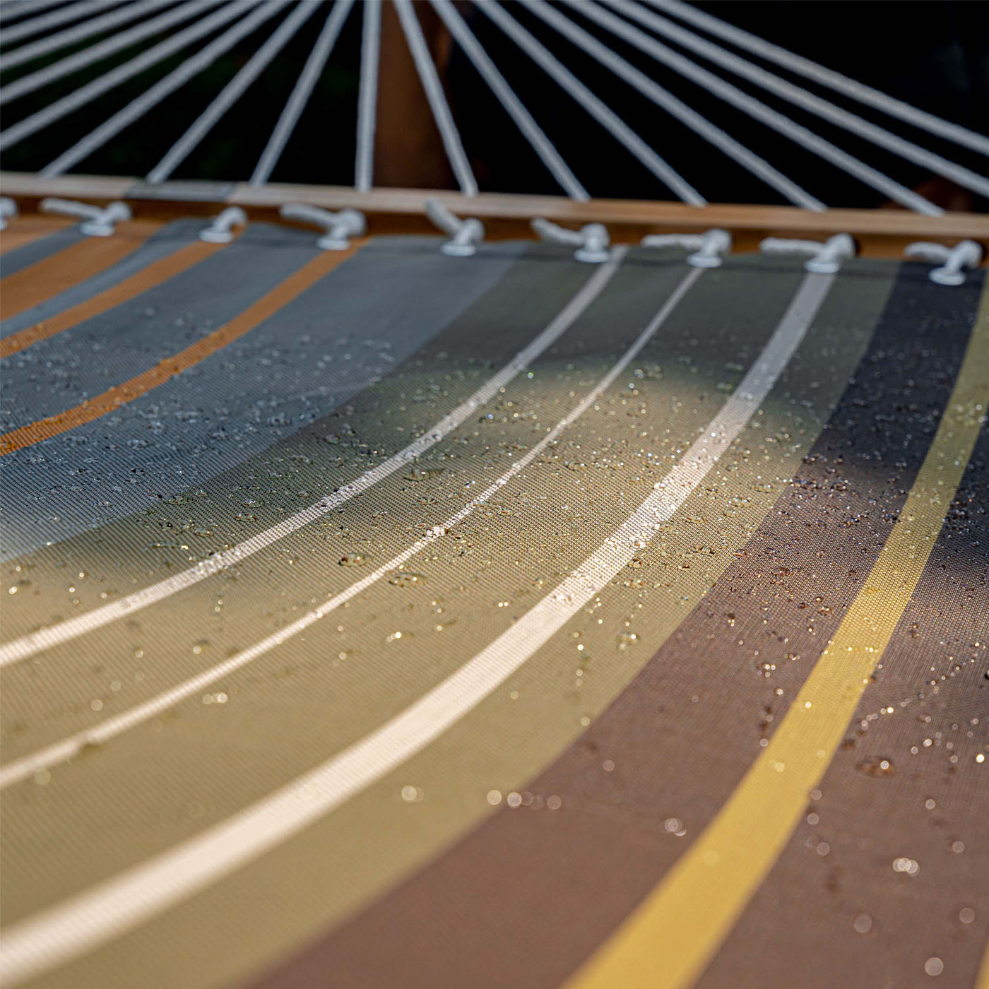 Detailed view of the Quick Dry Textilene fabric on Lazy Daze Double Poolside Hammock in Coffee Stripes.#color_coffee-stripes