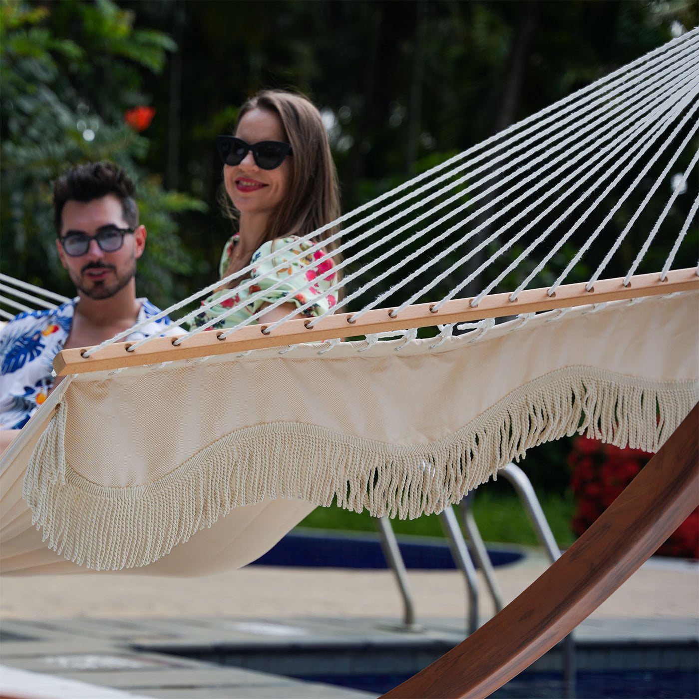 Close-up view of the elegant tassels on a Lazy Daze quilted hammock in natural solid color.#color_natural-solid-with-tassels