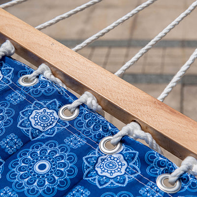 Detailed view of Lazy Daze Double Reversible Quilted Hammock with hardwood spreader bar and floral pattern.#color_floral-blue