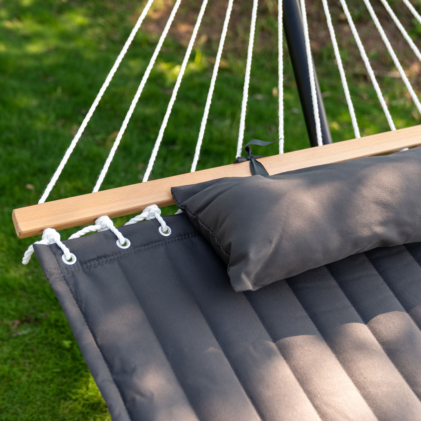 Lazy Daze large double quilted hammock featuring a hardwood spreader bar and pillows for added relaxation.#color_dark-gray