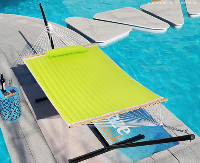 Lazy Daze large double quilted hammock placed by the poolside, offering a relaxing outdoor setting.#color_lemon-green