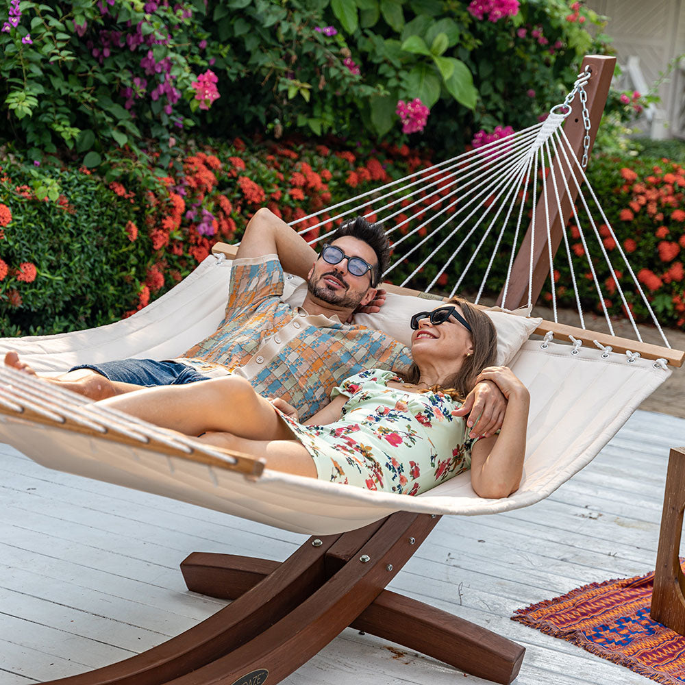 People enjoying relaxation on Lazy Daze Large Double Quilted Hammock in Natural Solid in the backyard.#color_natural-solid