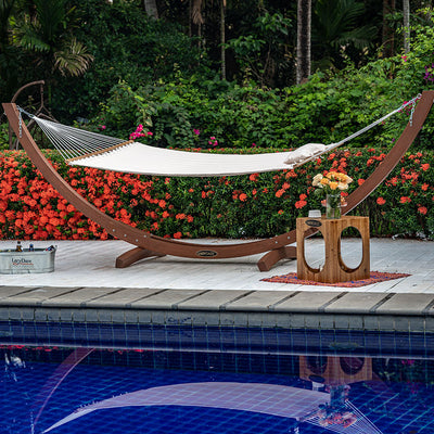 Lazy Daze Large Double Quilted Hammock in Natural Solid placed by the poolside.#color_natural-solid