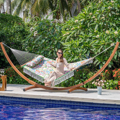 Lazy Daze large double reversible quilted hammock in a serene backyard setting, perfect for relaxation.