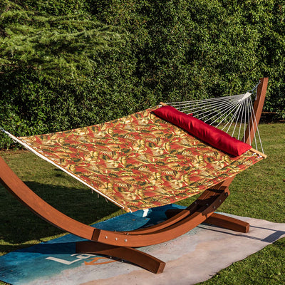 Lazy Daze large double reversible quilted hammock with red floral design, placed on grass for relaxation.#color_floral-red