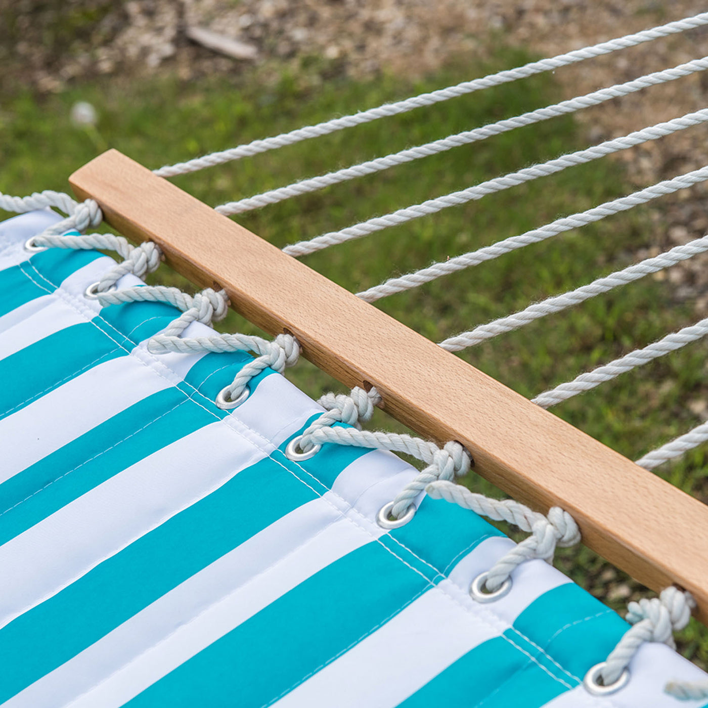 Sturdy hardwood spreader bar detail on the Lazy Daze Large Double Stripes Quilted Hammock.#color_aqua-white-stripes