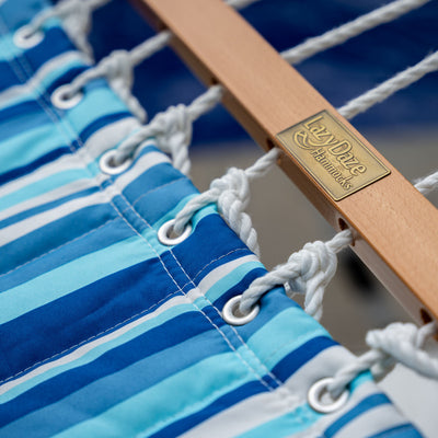 Hardwood spreader bar detail on Lazy Daze Large Double Stripes Quilted Hammock in Blue Stripes.#color_blue-stripes