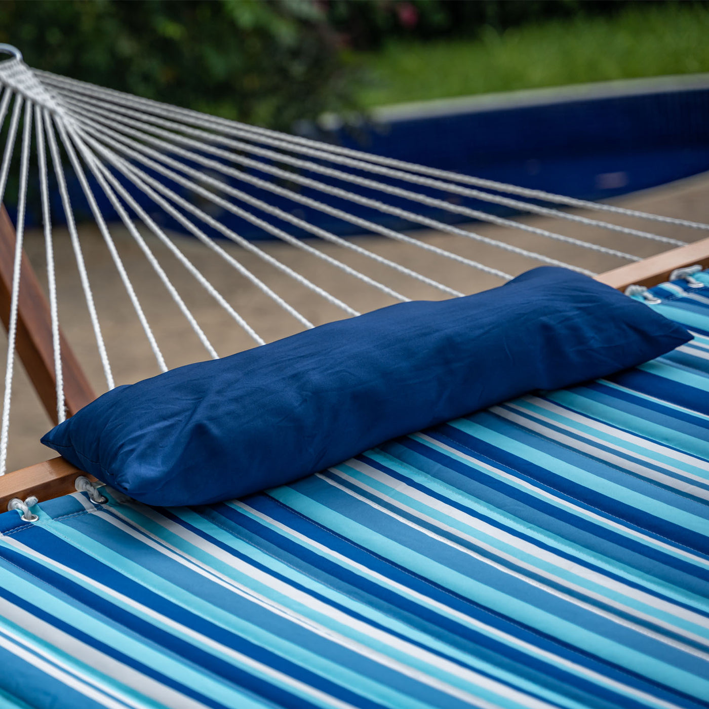 Detachable pillow detail on Lazy Daze Large Double Stripes Quilted Hammock in Blue Stripes.#color_blue-stripes