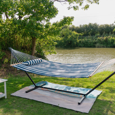 Lazy Daze Large Double Stripes Quilted Hammock in Blue White Stripes resting on an outdoor lawn.#color_blue-white-stripes