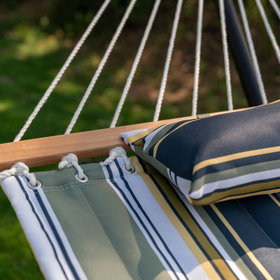 Soft fabric and pillow of the Lazy Daze Large Double Stripes Quilted Hammock in Forest Stripes design.#color_forest-stripes