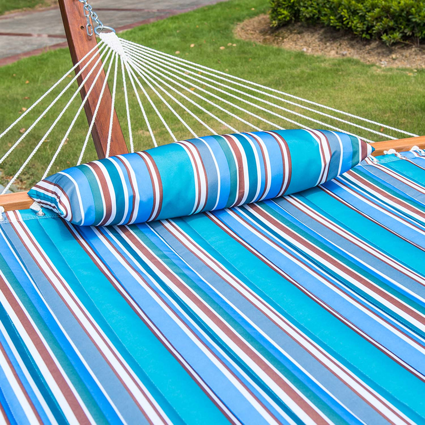 Plush comfort fabric and removable pillow of the Lazy Daze Large Double Stripes Quilted Hammock.#color_peacock-stripes