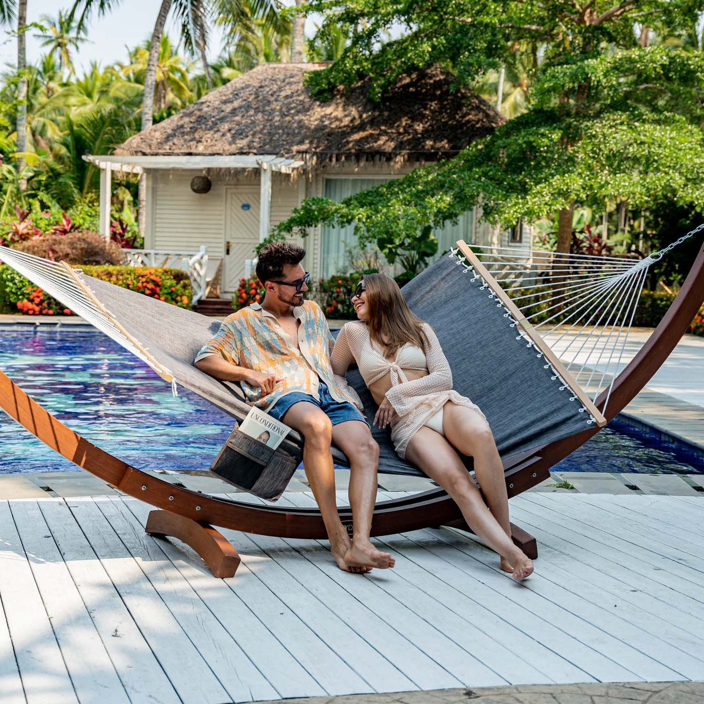 Couple enjoying a relaxing moment on the Lazy Daze Quick Dry Hammock Olefin Blend Textliene in Black in backyard.#color_black