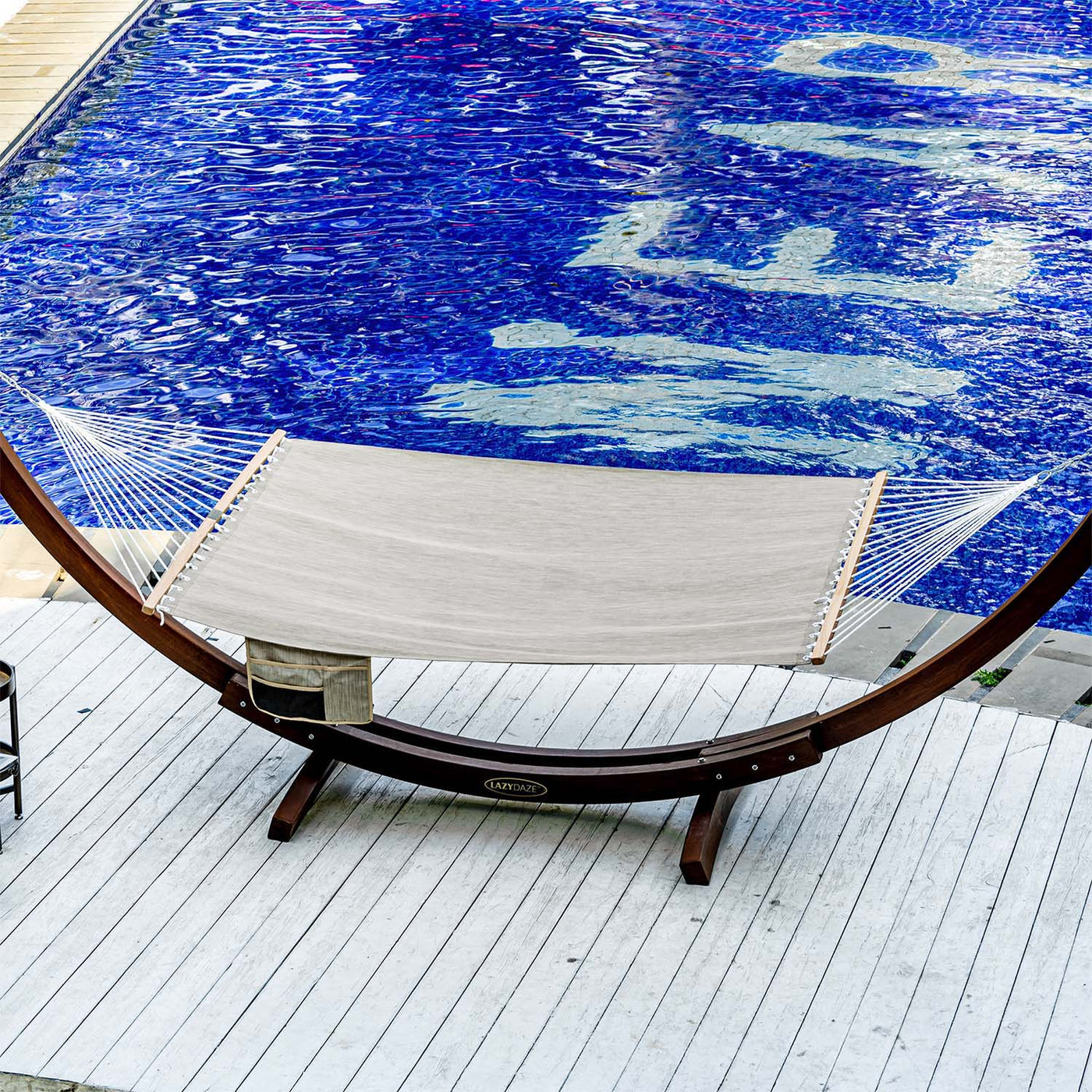 Lazy Daze Quick Dry Hammock in Khaki by the poolside, perfect for outdoor lounging.#color_kahki