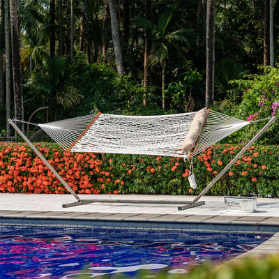 Lazy Daze rope hammock combo without cushion, set up outdoors with a steel stand.#color_tan-pillow