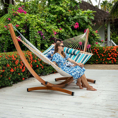 A man and woman enjoying a relaxed moment on the Lazy Daze Sunbrella Double Quilted Hammock.#color_#color_gateway-mist