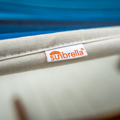 Sunbrella logo featured on the Lazy Daze Sunbrella Double Quilted Hammock in Gateway Mist.#color_gateway-indigo