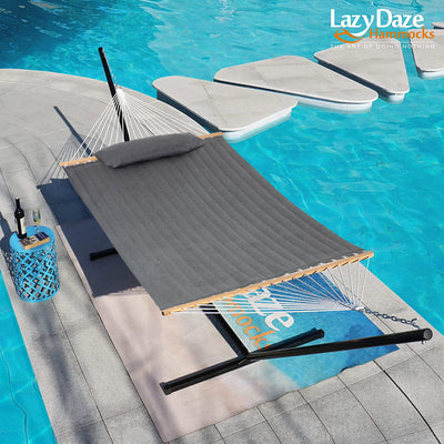 Lazy Daze Sunbrella Double Quilted Hammock in Gray gently resting beside the pool.#color_gray