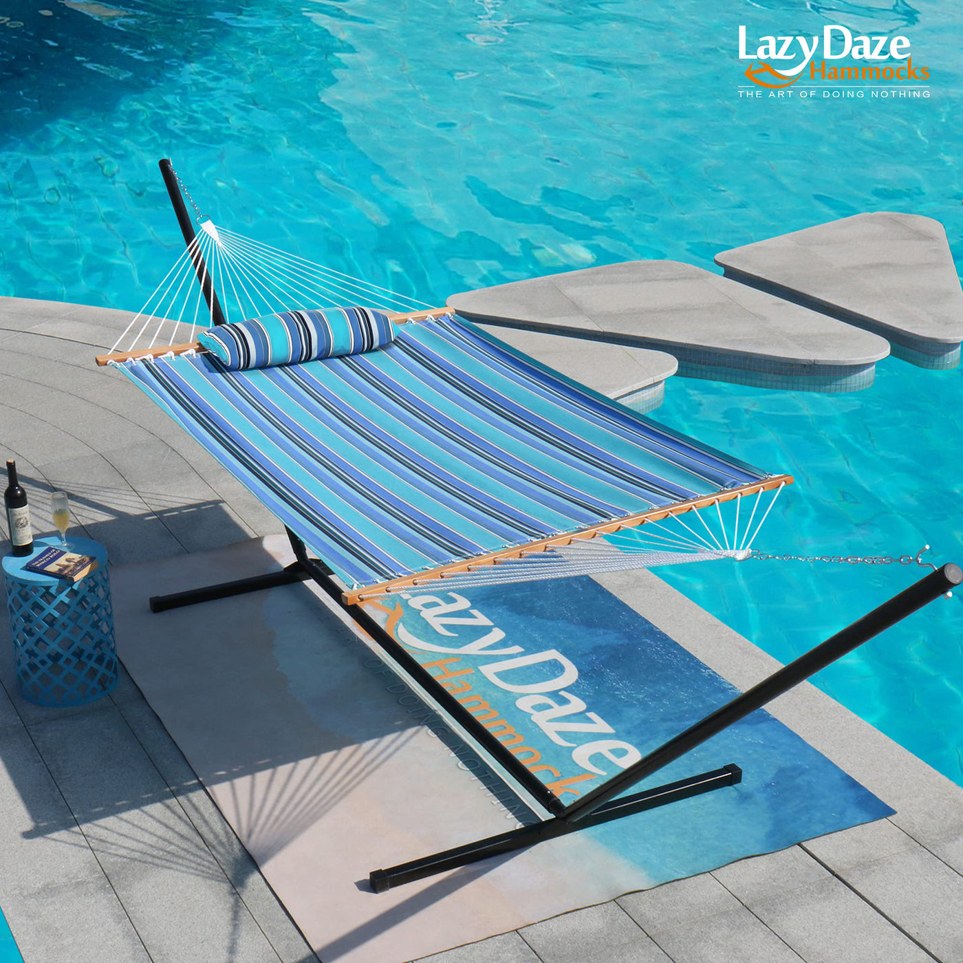 Lazy Daze Sunbrella Single-layer Hammock, set up beside a tranquil poolside for relaxation.#color_gateway-mist