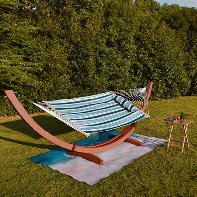 Lazy Daze Sunbrella Single-layer Hammock set up on grass in a beautiful outdoor space.
#color_token-surfside